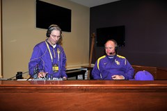 Franques (left) hosts a LSU baseball postgame radio show with Coach Paul Mainieri.